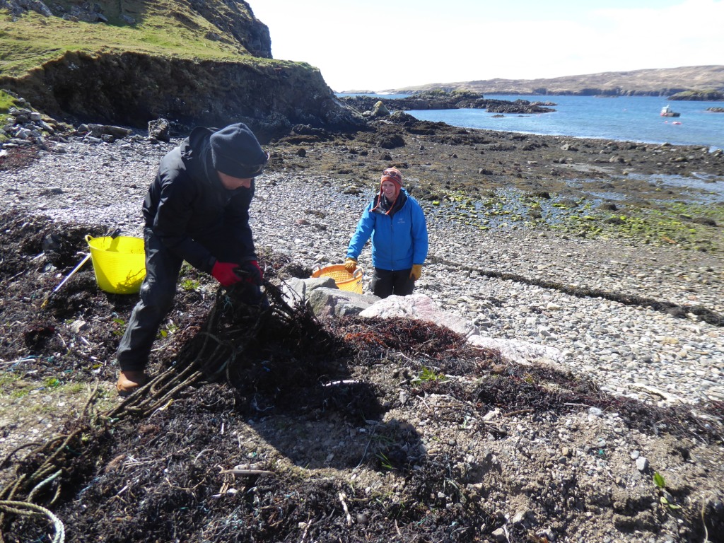 Volunteers collecting litter from Tarbet beach © Scottish Wildlife Trust